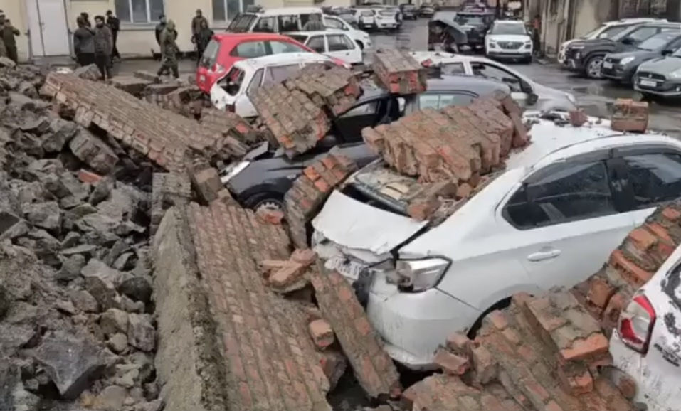 Parked vehicles damaged as wall collapses at JLNM hospital Rainawari amid rains