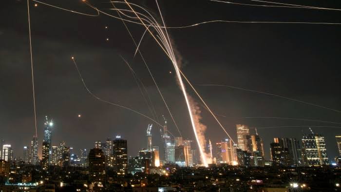 Iran launches waves of missiles at Israel in response to attacks